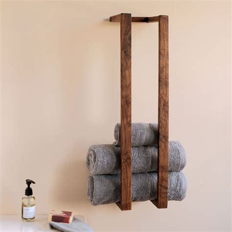 It's crafted from engineered <b>wood</b> in a neutral white hue that complements most styles and color schemes. . Wall mounted wood towel rack